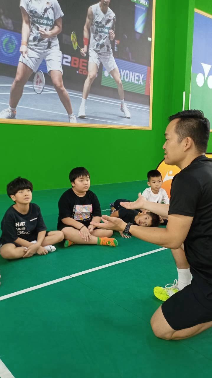 Camp activities, coach interacting with children