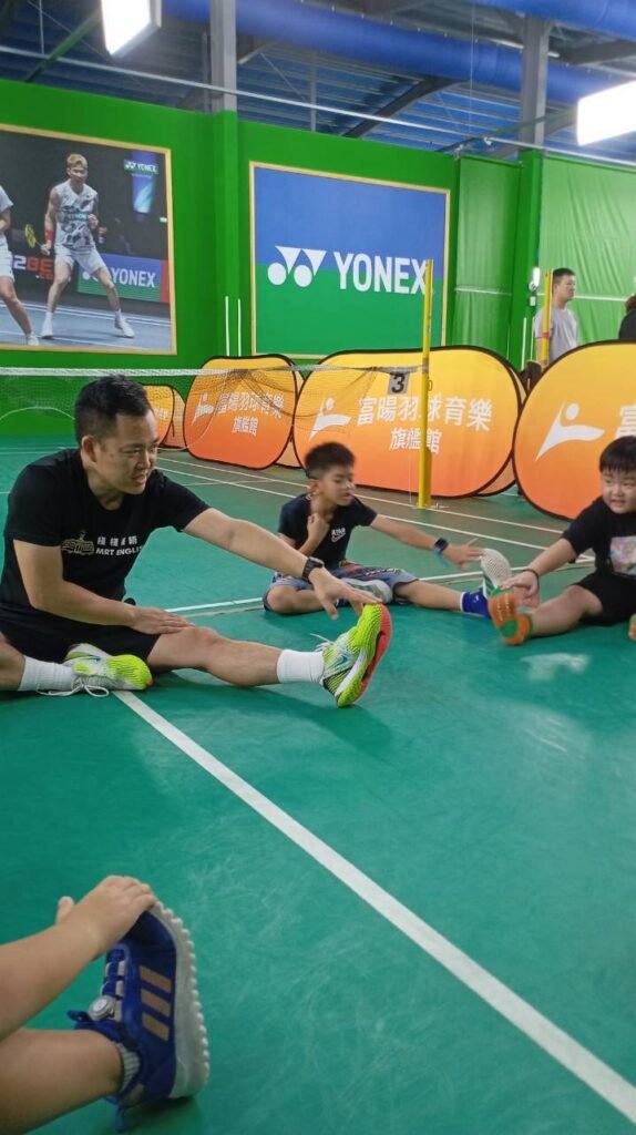 Good Good English children stretching and warming up during sports Good Good English children stretching during a movement activity